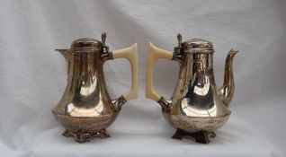 An Art Deco silver coffee pot and matching hot water jug,