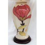 A Moorcroft "Magnolia" pattern pottery table lamp, in cream, of baluster form,