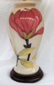 A Moorcroft "Magnolia" pattern pottery table lamp, in cream, of baluster form,