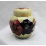 A Moorcroft pottery ginger jar and cover decorated in the anemone pattern to a yellow to green