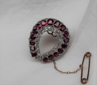 A ruby and diamond brooch,