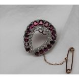 A ruby and diamond brooch,