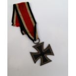 A WWII German Third Reich Iron Cross 2nd Class Medal, 1939 and swastika to fascia, 1813 to verso,