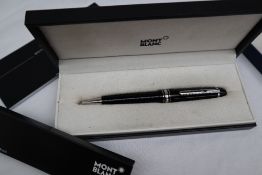 A Montblanc Meisterstuck rollerball pen together with a Waterman propelling pencil,