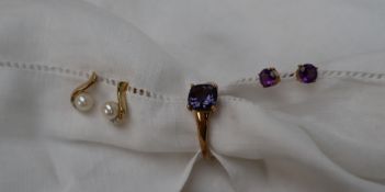 A 9ct yellow gold amethyst set dress ring together with a pair of amethyst earrings and a pair of