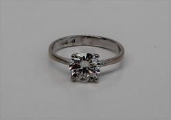 A solitaire diamond ring the round brilliant cut diamond approximately 1ct to a white metal claw