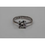 A solitaire diamond ring the round brilliant cut diamond approximately 1ct to a white metal claw