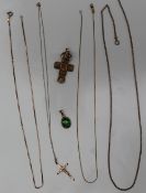 A 9ct yellow gold cross on a chain together with other 9ct yellow gold necklaces, approximately 13.