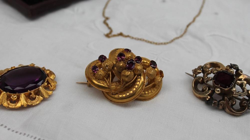 A Victorian brooch, set with a central faceted amethyst in a yellow metal mount, - Image 4 of 6