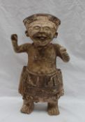 A pre-Columbian type figure of a "Smiling" figure or Sonrientes, nude from the waist up,