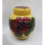 A large Moorcroft ginger jar and cover, decorated in the Hibiscus pattern to a yellow ground,