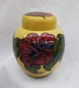 A large Moorcroft ginger jar and cover, decorated in the Hibiscus pattern to a yellow ground,
