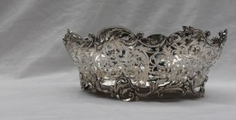 An Edward VII silver bowl, of oval form with a scrolling edge and pierced body,