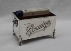 An Edwardian silver bridge box, with three compartments for playing cards,