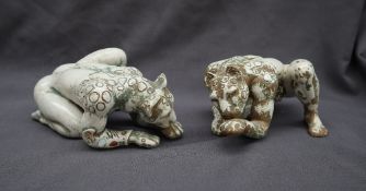 A pair of continental pottery anthropomorphic leopards, with the head and fore limbs of a leopard,