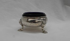 A George II silver salt of cauldron shape on three legs with pad feet, London, 1737,