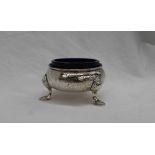 A George II silver salt of cauldron shape on three legs with pad feet, London, 1737,