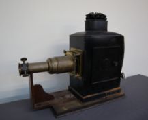 A japanned tin and brass magic Lantern,