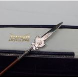 An Elizabeth II silver and rosewood paper knife in the form of a pike, London, 1978,