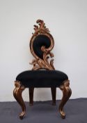 A gilt decorated bedroom chair,