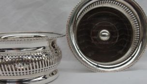 A pair of silver plated on copper bottle coasters,