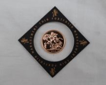 A 2015 United Kingdom gold sovereign,