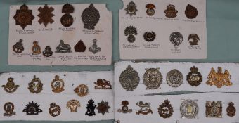 A collection of circa forty military cap badges including Argyle and Sutherland,