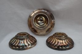 A pair of Camusso Peruvian white metal candle sticks, of circular form with a gadrooned edge, 9.