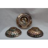A pair of Camusso Peruvian white metal candle sticks, of circular form with a gadrooned edge, 9.