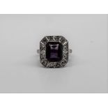 An amethyst and diamond ring,