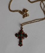 An 18ct yellow gold cross pendant, set with six emeralds on an 18ct yellow gold chain,