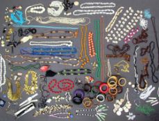 A large quantity of costume jewellery including a Robyn Gordon shell and resin necklace,