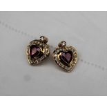 A pair of heart shaped ruby and diamond stud earrings, the central heart shaped ruby,