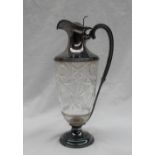 A late Victorian silver mounted and cut glass claret jug,