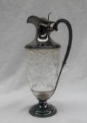 A late Victorian silver mounted and cut glass claret jug,