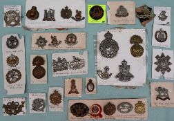 A collection of circa thirty five military cap badges including the Royal Highlanders,