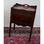 A George III mahogany night table with tray top above a drawer and pair of cupboard doors and