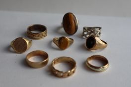 Three 9ct yellow gold wedding bands, together with 9ct gold signet rings, tigers eye signet ring,