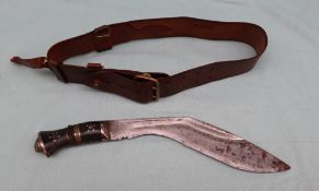 A Gurkha sword with an inlaid handle together with a brown leather belt