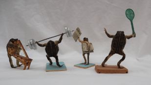 Taxidermy - a set of four toads in various poses, including a weight lifter, newspaper seller,