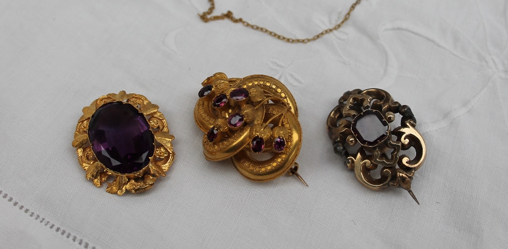 A Victorian brooch, set with a central faceted amethyst in a yellow metal mount, - Image 3 of 6