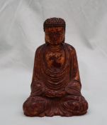 A chinese carved, gilt and lacquered seated buddhistic figure,