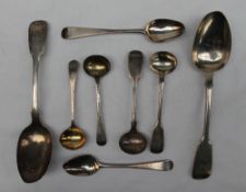 A Victorian silver fiddle pattern dessert spoon, London, 1854, together with another dessert spoon,