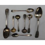 A Victorian silver fiddle pattern dessert spoon, London, 1854, together with another dessert spoon,