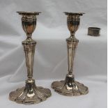 A pair of Elizabeth II silver candlesticks,