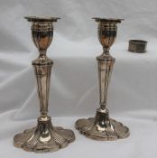 A pair of Elizabeth II silver candlesticks,