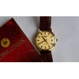 A Gentleman's Longines Conquest automatic wristwatch, the gilt dial with batons and a date aperture,