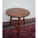 An early 19th century pine cricket table,