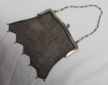 An Edwardian silver and mesh purse, on an oval link chain, import marks for Chester, 1915,