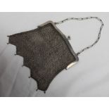 An Edwardian silver and mesh purse, on an oval link chain, import marks for Chester, 1915,